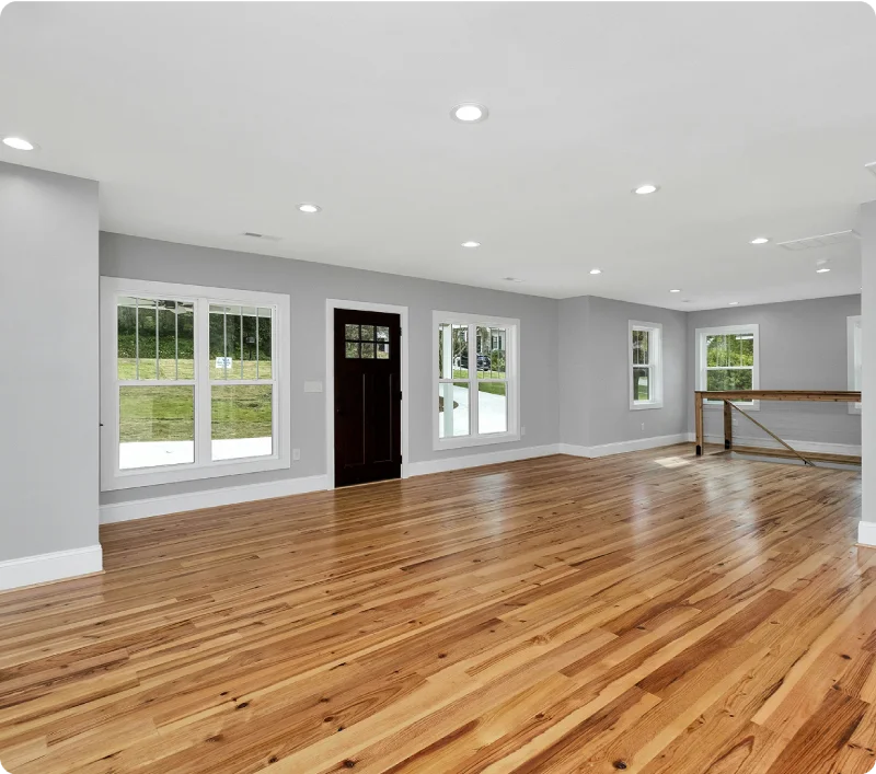 Empty room with polished hardwood floors after move-in or move-out cleaning.